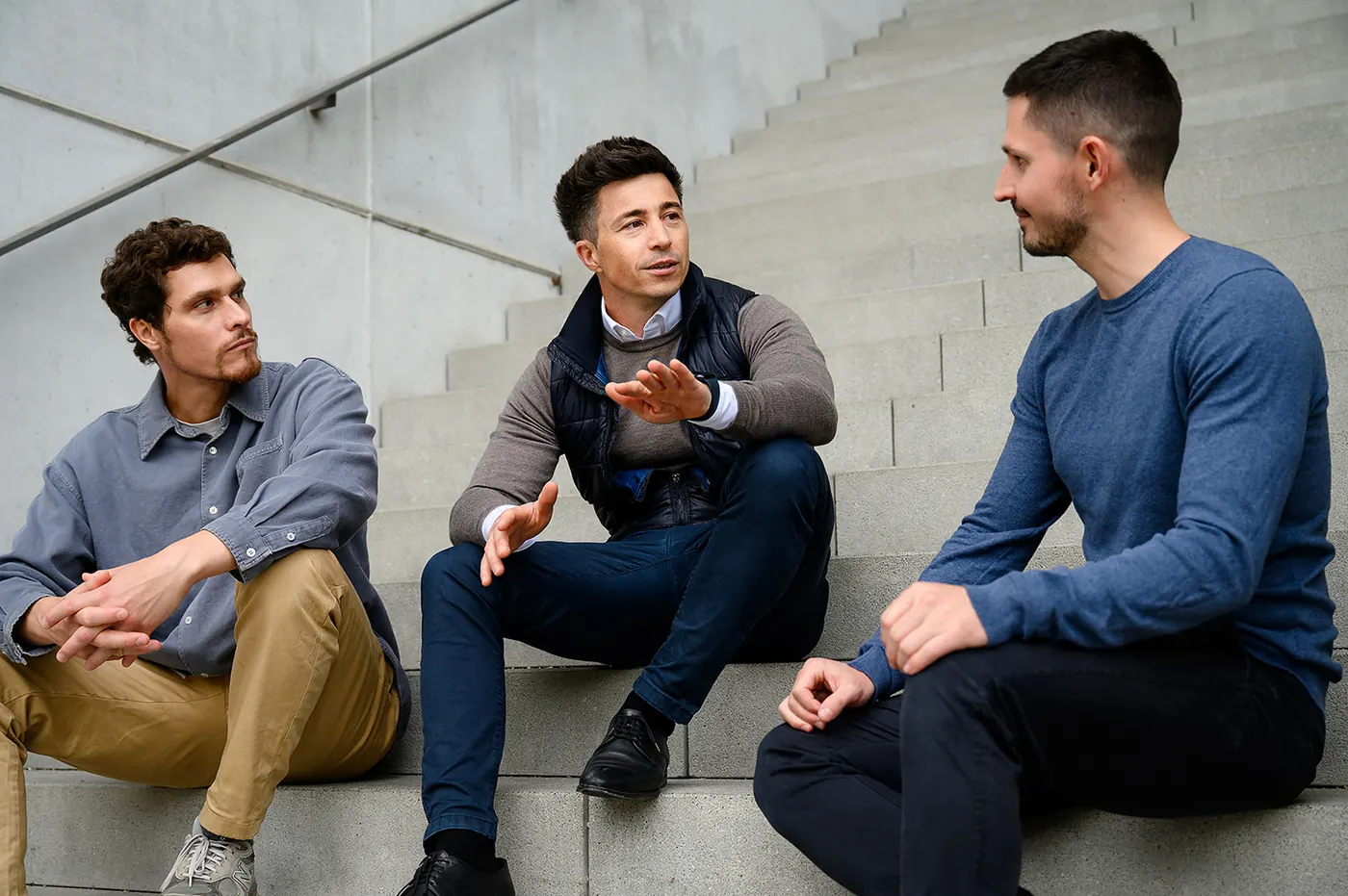 The founders of Lextract in conversation on a staircase